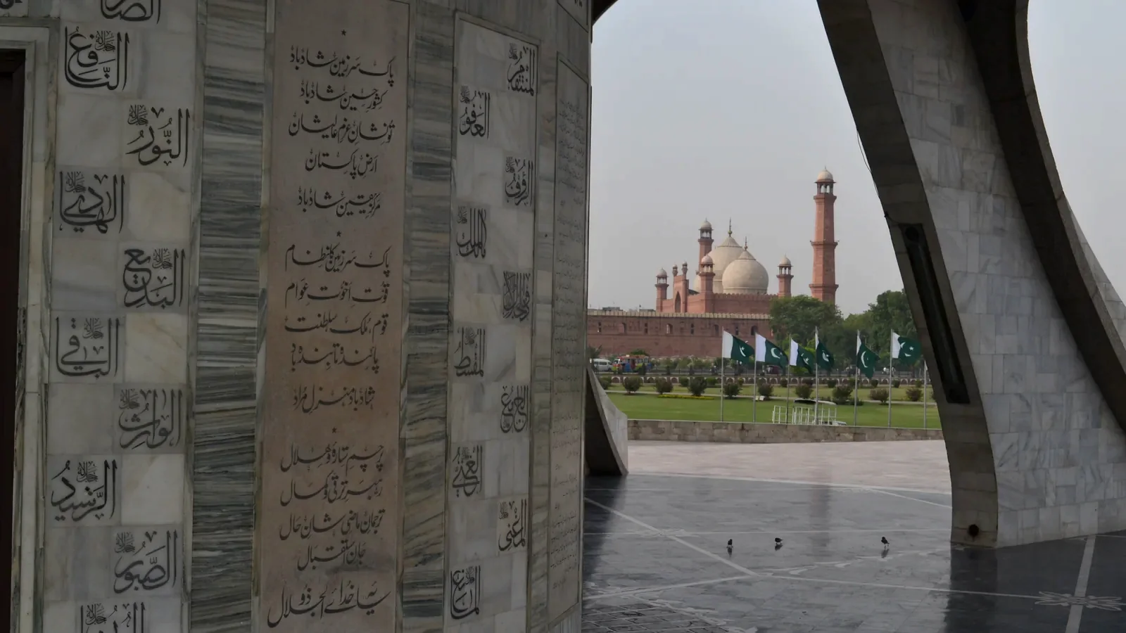Badshahi Mosque framed through an arch of Minar-e-Pakistan in Lahore