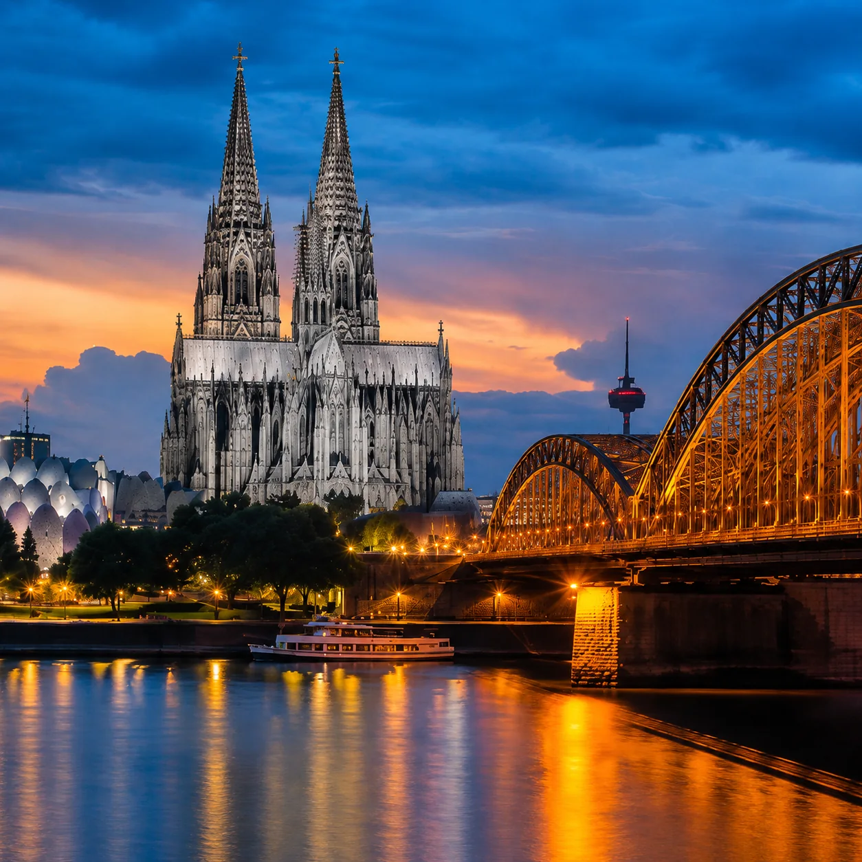 Cologne Cathedral and Hohenzollern Bridge at sunset in Germany