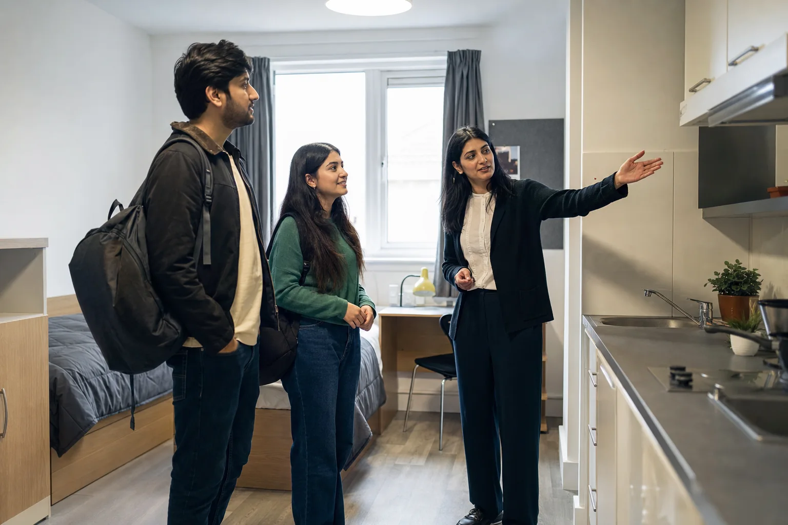Pakistani students inspecting shared student accommodation